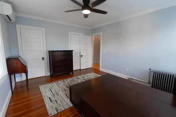 a bedroom with bed and a window