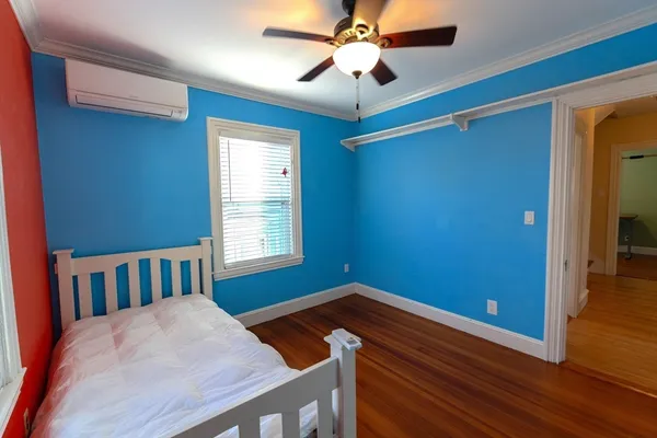a bed room with a bed and a chandelier