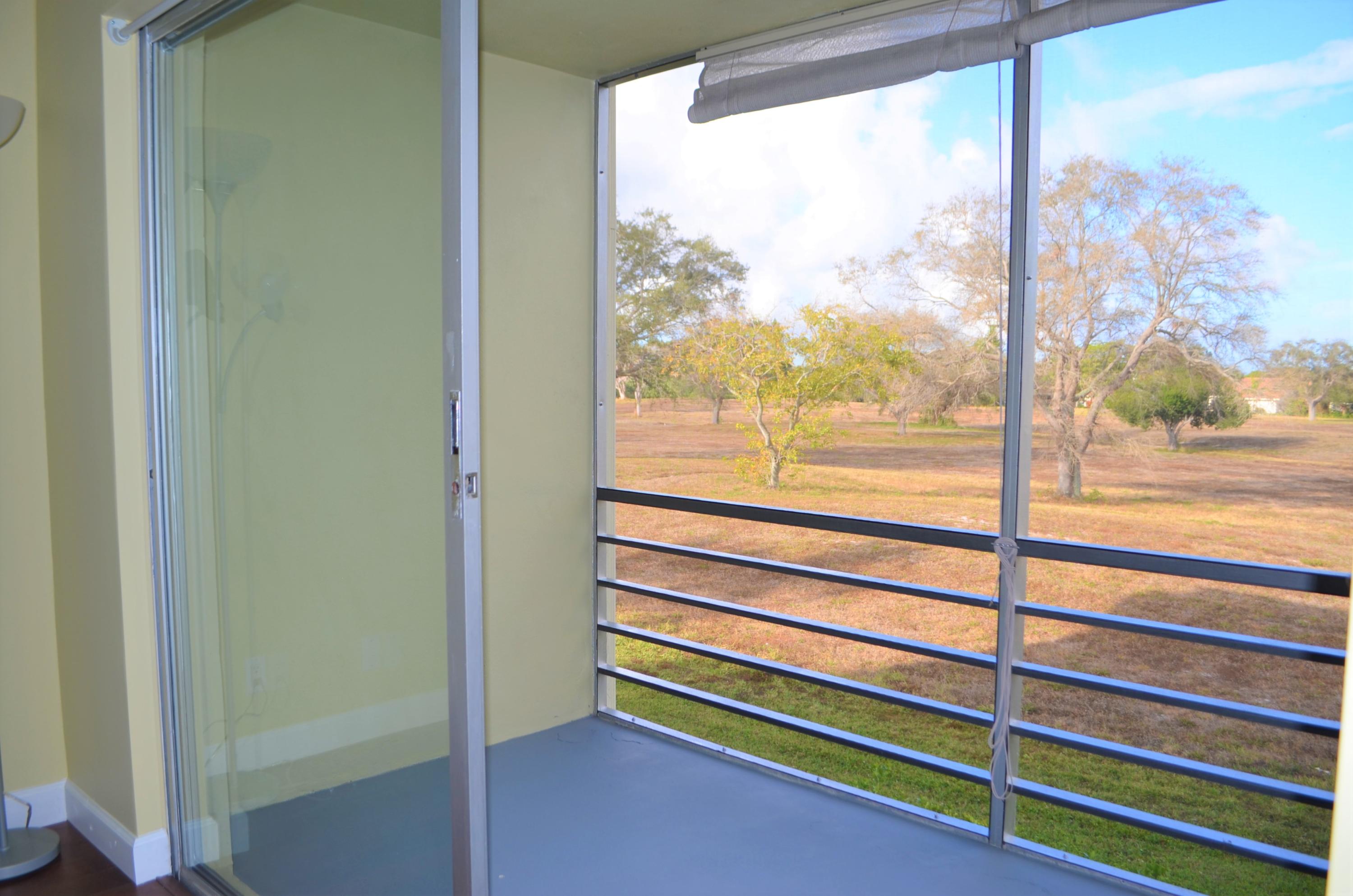 5701 Northwest 2nd Avenue, Unit 2070 Boca Raton, FL 33487 - Photo 17 of 26 Patio View of Park/Golf Course