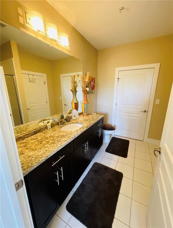 799 Hammond Drive Atlanta, GA 30328 - Photo 15 of 21 a bathroom with a granite countertop sink and a mirror