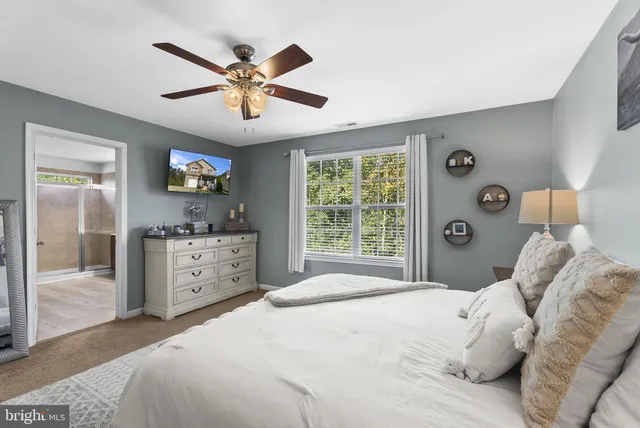 a bathroom with a sink a mirror and a window