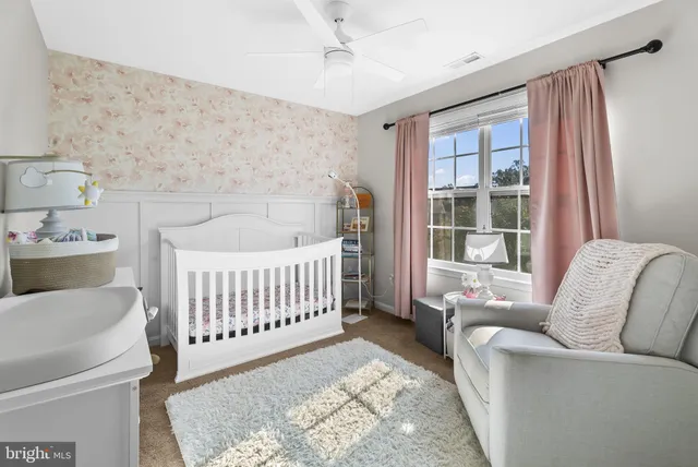 a bathroom with a sink vanity mirror and toilet