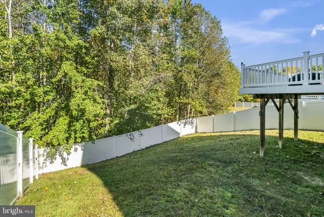 a view of a balcony with wooden floor