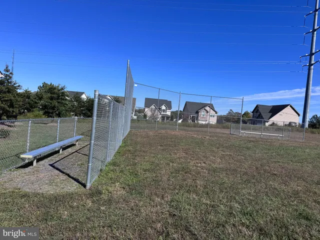 a view of a chair and tables in the patio
