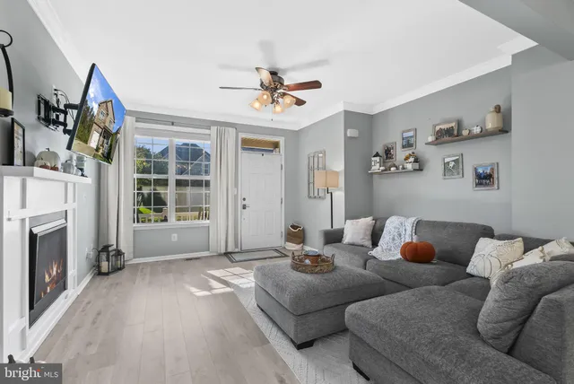 a kitchen with stainless steel appliances a stove a sink a microwave a refrigerator and cabinets