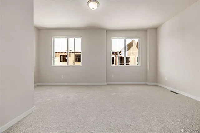 an empty room with windows