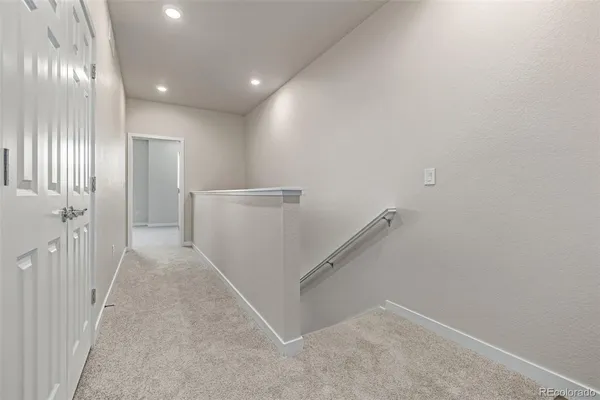 a view of a hallway with entryway