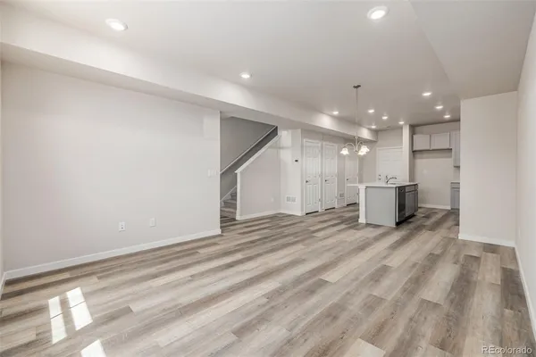 a view of a kitchen with a sink and cabinets