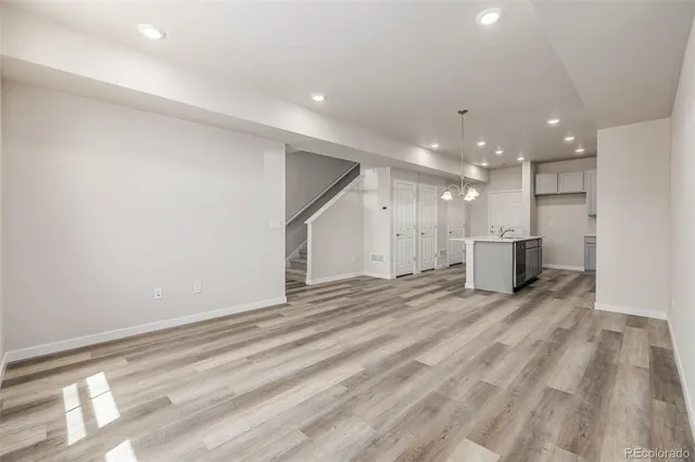 a view of a kitchen with a sink and cabinets