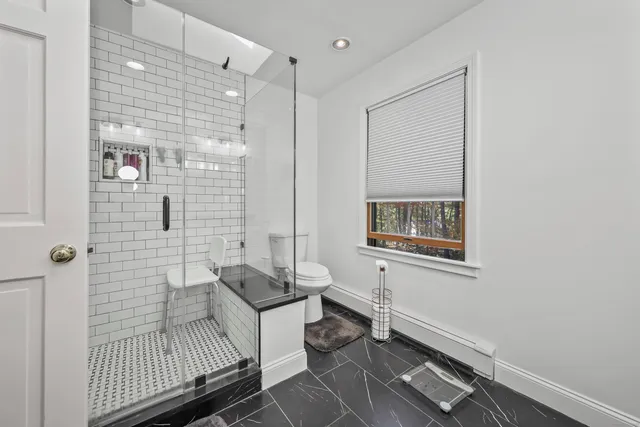 a bathroom with a bathtub and shower