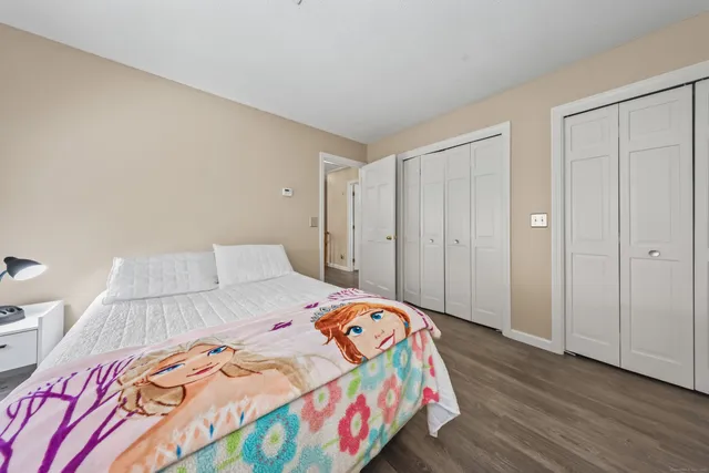 a bedroom with a bed and a closet