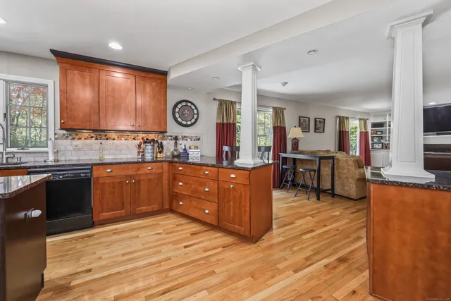 a kitchen with lots of counter top space and living room