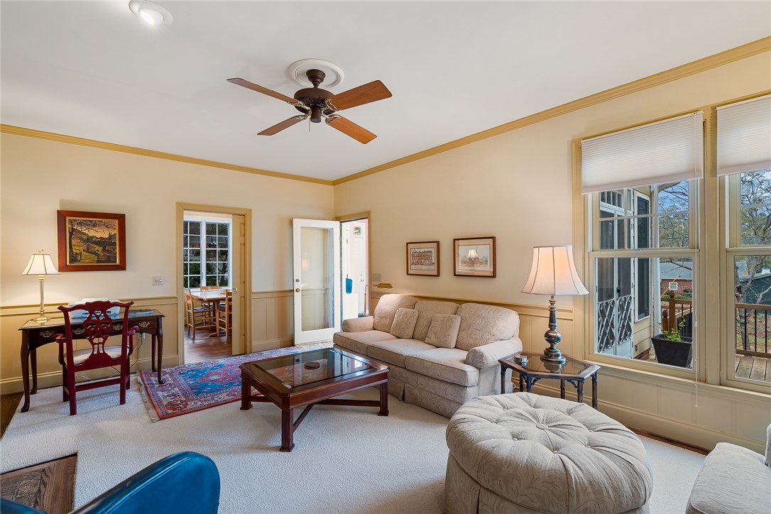 401 Berkshire Hill Anderson, SC 29621 - Photo 11 of 39 This bright living area features comfortable carpeted flooring and large windows, creating an inviting atmosphere.