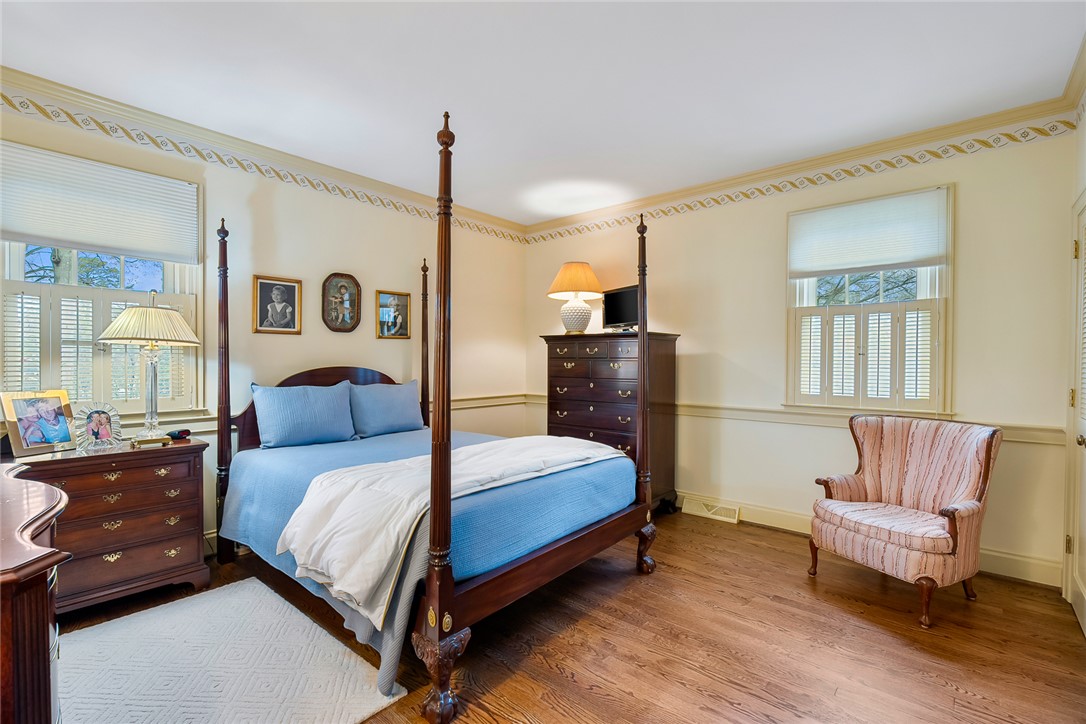 401 Berkshire Hill Anderson, SC 29621 - Photo 18 of 39 This spacious bedroom features classic hardwood floors and natural light.
