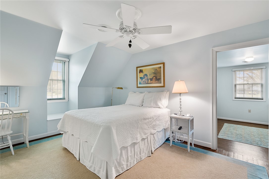 401 Berkshire Hill Anderson, SC 29621 - Photo 21 of 39 This airy bedroom features sloped ceilings and ample natural light, creating a bright and inviting retreat.