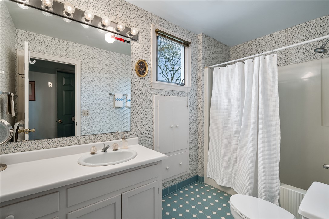 401 Berkshire Hill Anderson, SC 29621 - Photo 22 of 39 Bright and airy, this bath features classic tile flooring and a built-in storage cabinet.