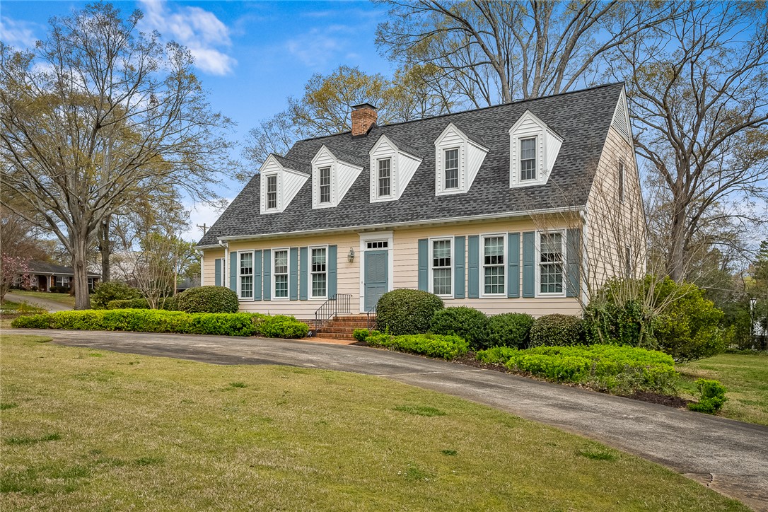 401 Berkshire Hill Anderson, SC 29621 - Photo 3 of 39 This charming home offers classic appeal with a welcoming facade and lush greenery.