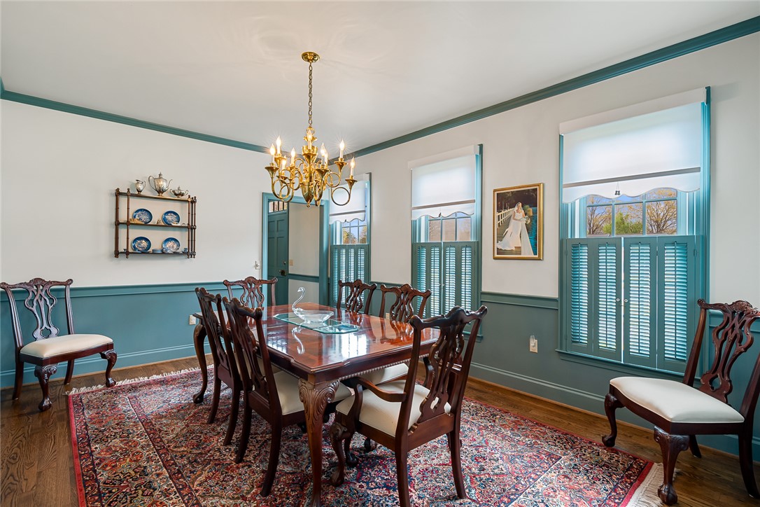 401 Berkshire Hill Anderson, SC 29621 - Photo 6 of 39 This formal dining space features rich wood flooring and classic window shutters.