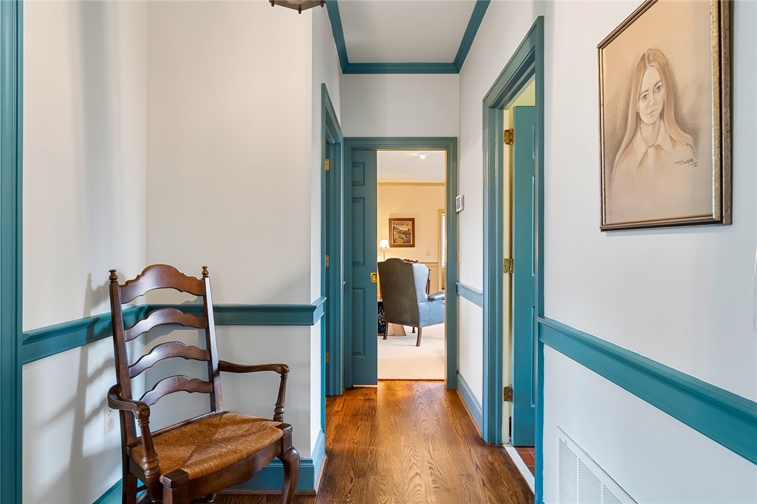 401 Berkshire Hill Anderson, SC 29621 - Photo 8 of 39 This charming hallway features warm wood flooring and inviting access to adjacent rooms.