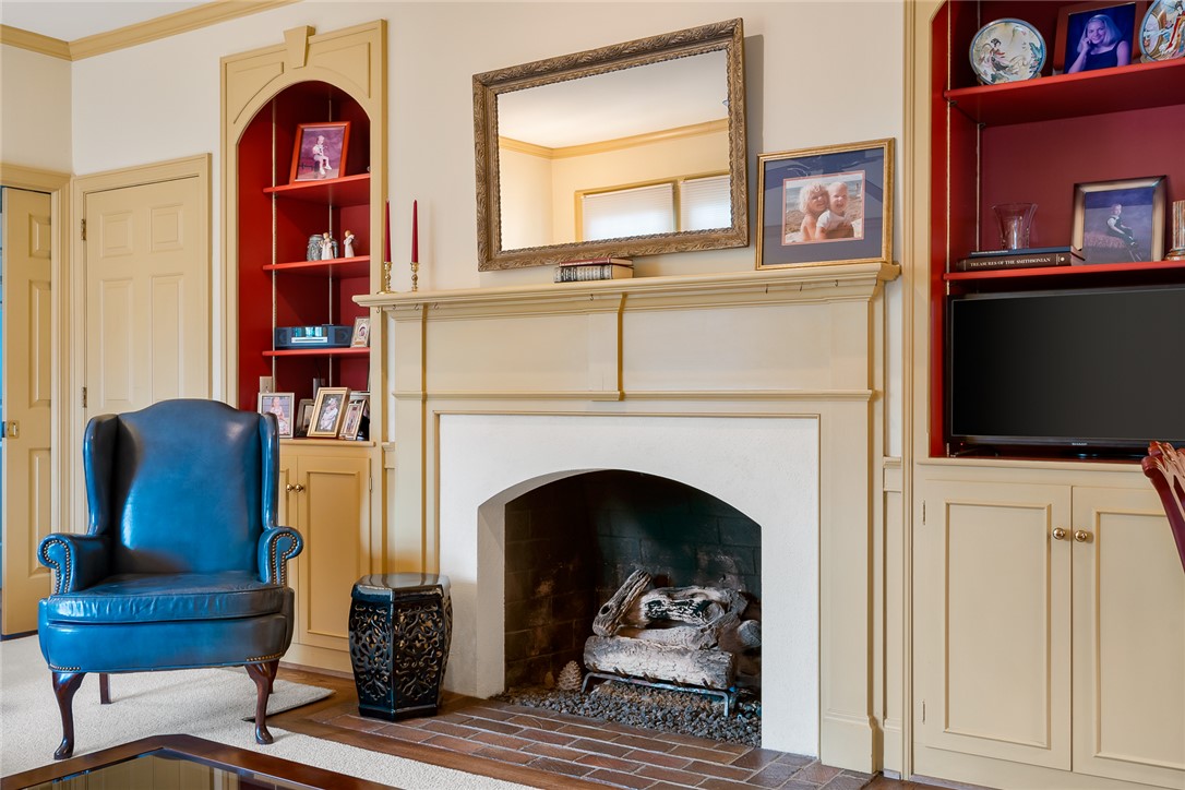401 Berkshire Hill Anderson, SC 29621 - Photo 10 of 39 This living room features a classic fireplace with elegant mantel and built-in shelving.