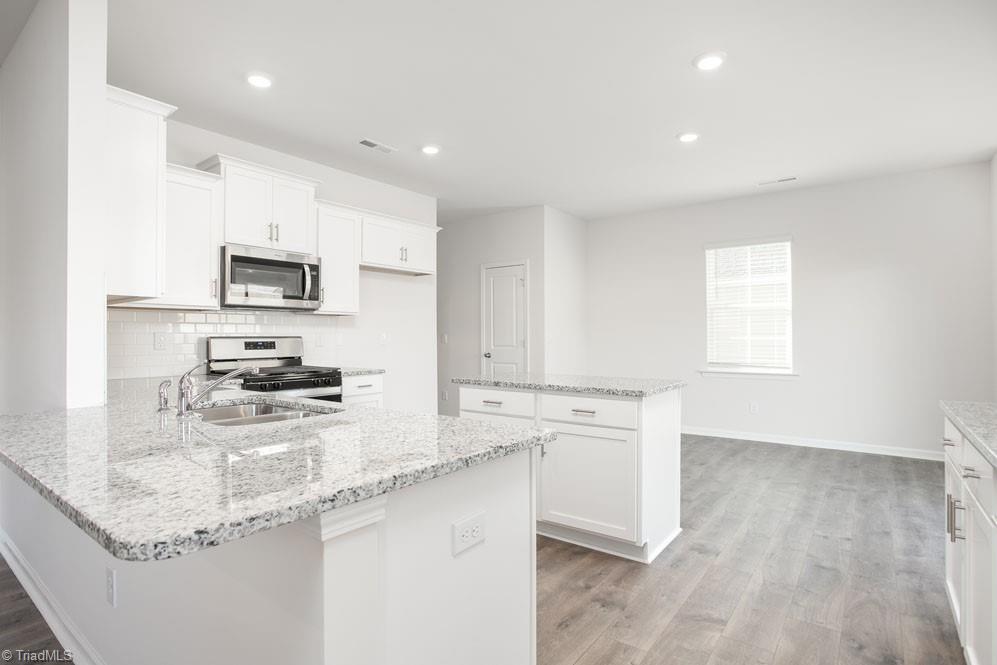 185 Pepper Tree Road Stokesdale, NC 27357 - Photo 12 of 30 The home model is a representative of its residential design