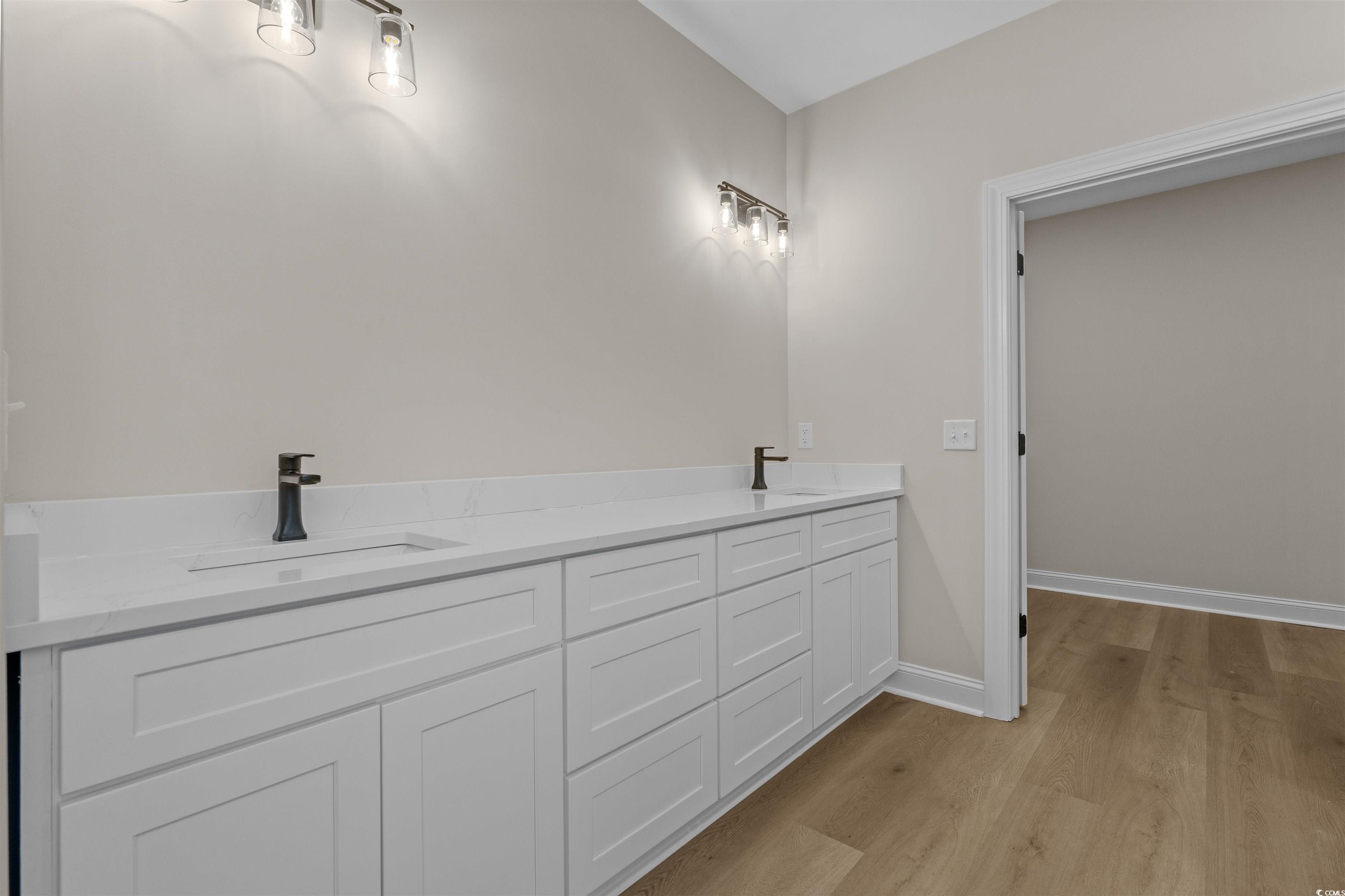 6927 Pauley Swamp Road Conway, SC 29527 - Photo 28 of 40 Full bath featuring double vanity and light wood finished floors