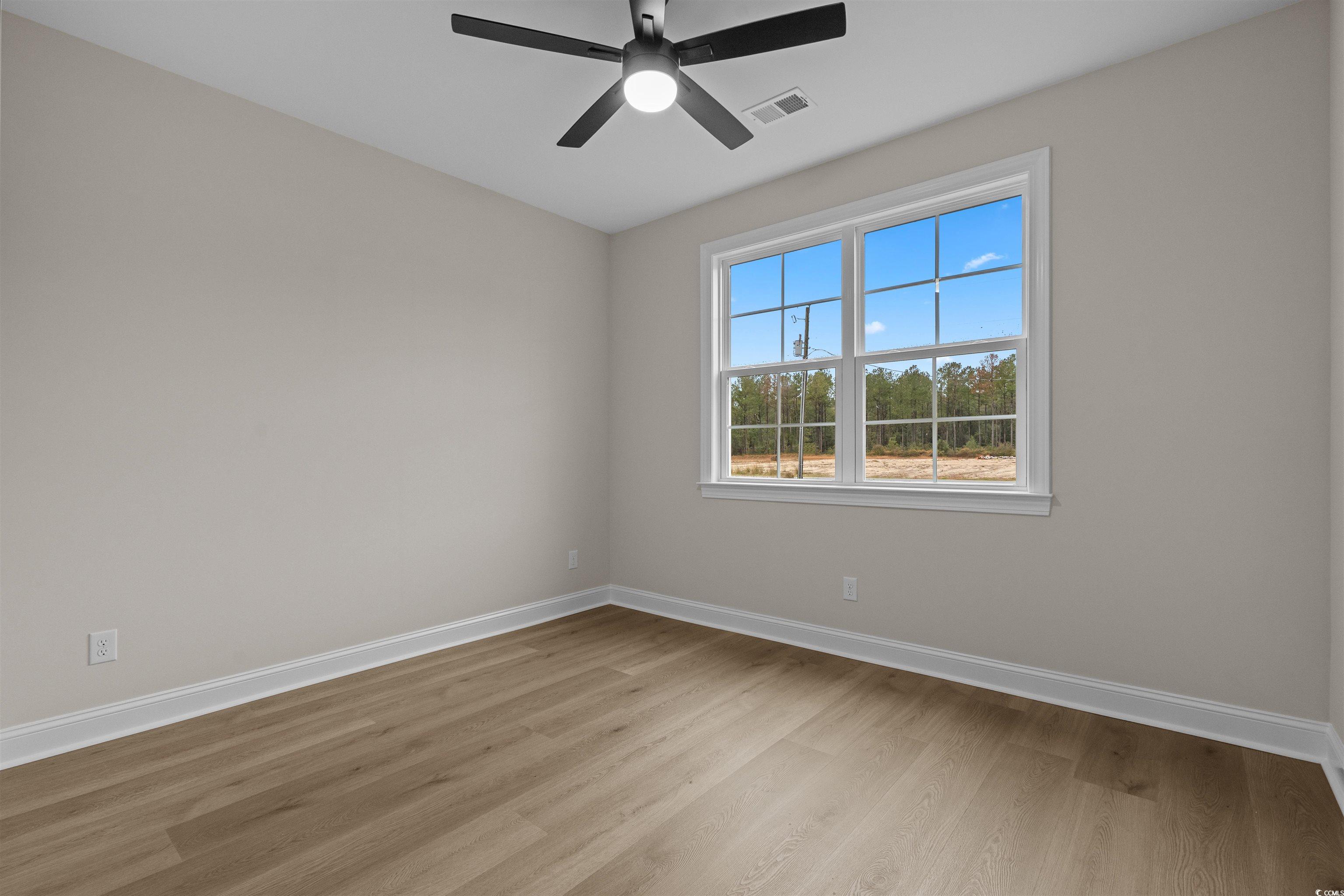 6927 Pauley Swamp Road Conway, SC 29527 - Photo 35 of 40 Spare room with light wood-style floors and a ceiling fan
