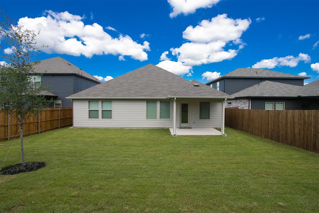 404 Castle Road Sherman, TX 75092 - Photo 25 of 25 a front view of a house with garden