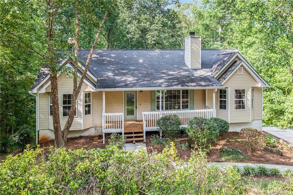 75 Whispering Way Dallas, GA 30157 - Photo 1 of 1 a front view of a house with a yard and porch
