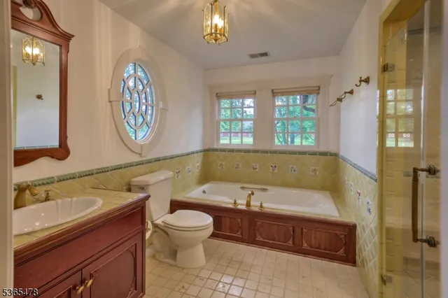 a bathroom with a sink a bathtub and a shower