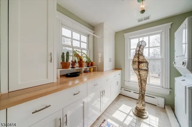 a spacious bathroom with a double vanity sink and a large mirror