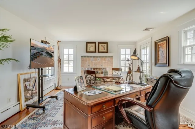 a view of a livingroom with furniture and a window