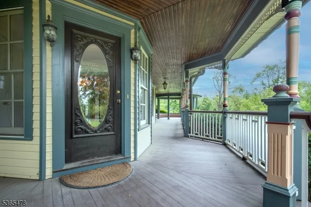 a view of a balcony with floor to ceiling window wooden floor