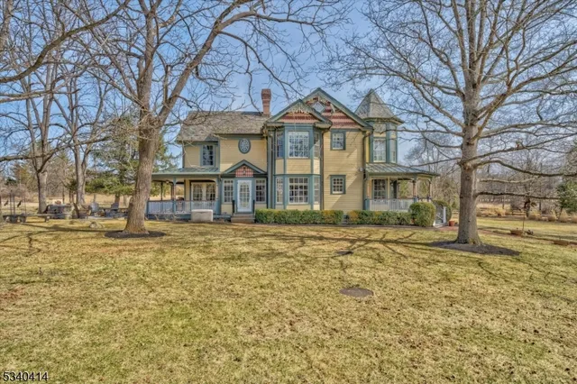 a front view of a residential houses with yard
