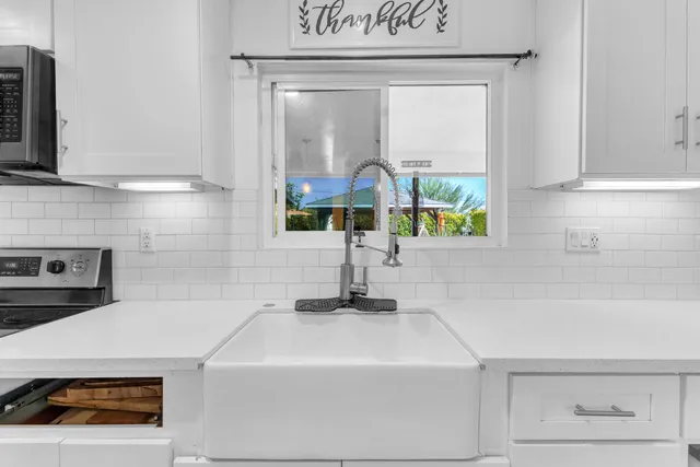 a kitchen with a refrigerator stove and microwave