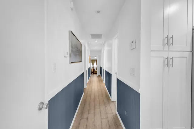 a bedroom with a bed and a ceiling fan