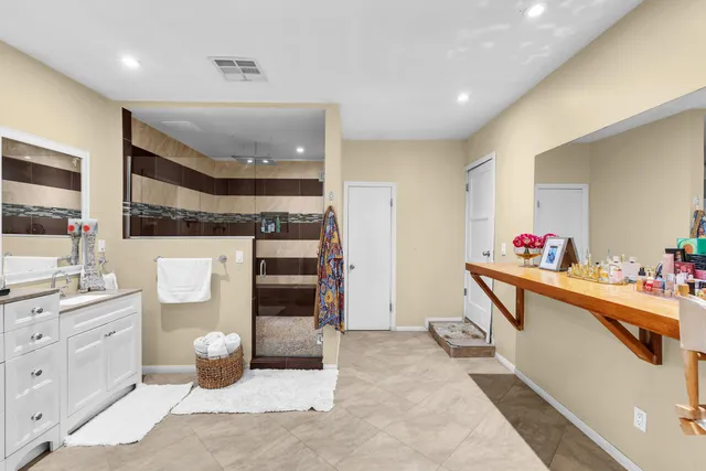 a view of a patio with table and chairs and potted plants