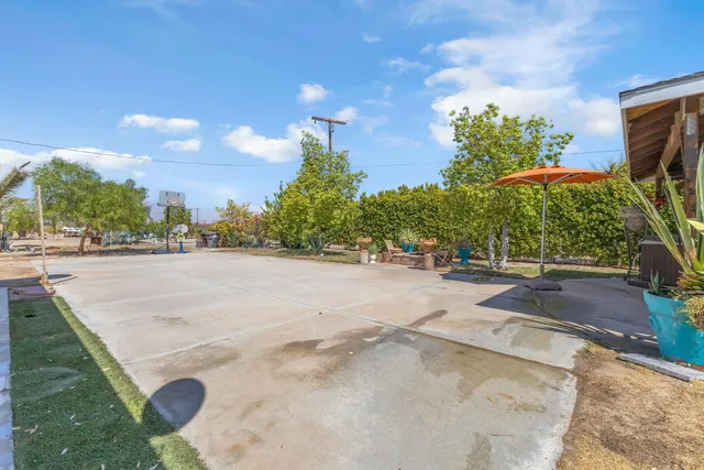 a view of a street with a building in the background