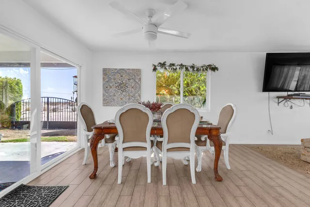 a large kitchen with stainless steel appliances lots of counter space and a sink
