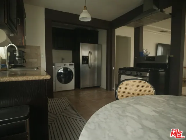 a bedroom with a bed and a sink