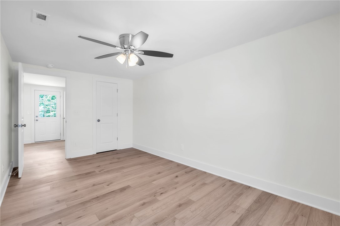 7 Beaverdam Road Williamston, SC 29697 - Photo 22 of 27 LVP floors and bright white walls create a versatile canvas for any design vision.