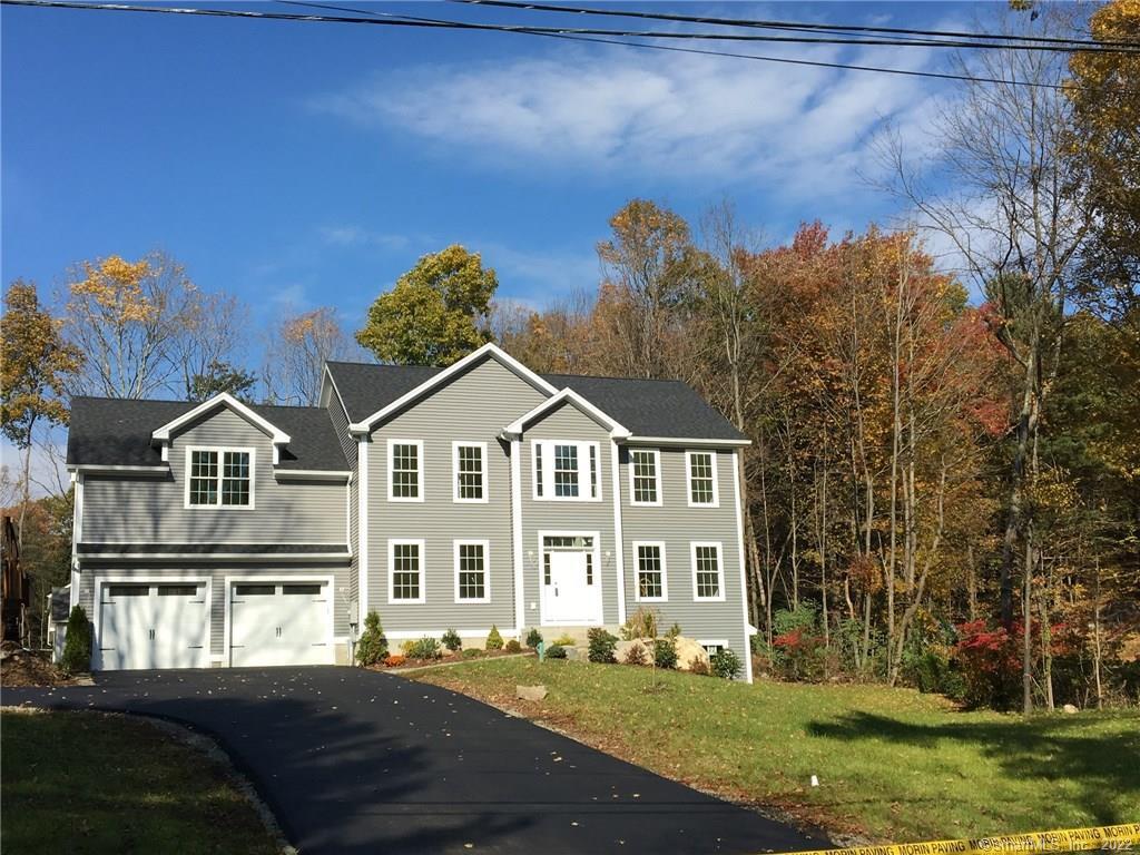 118 Chevas Road Avon, CT 06001 - Photo 1 of 1 a front view of a house with a garden