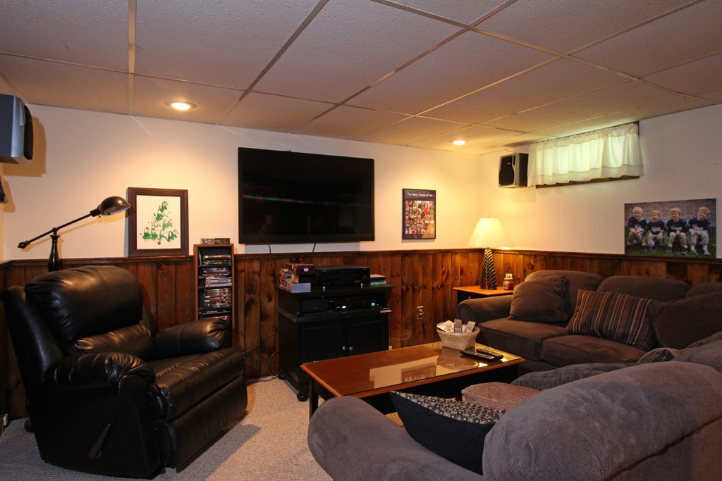 11 Bayberry Hill Road Townsend, MA 01469 - Photo 13 of 21 a living room with furniture and a flat screen tv