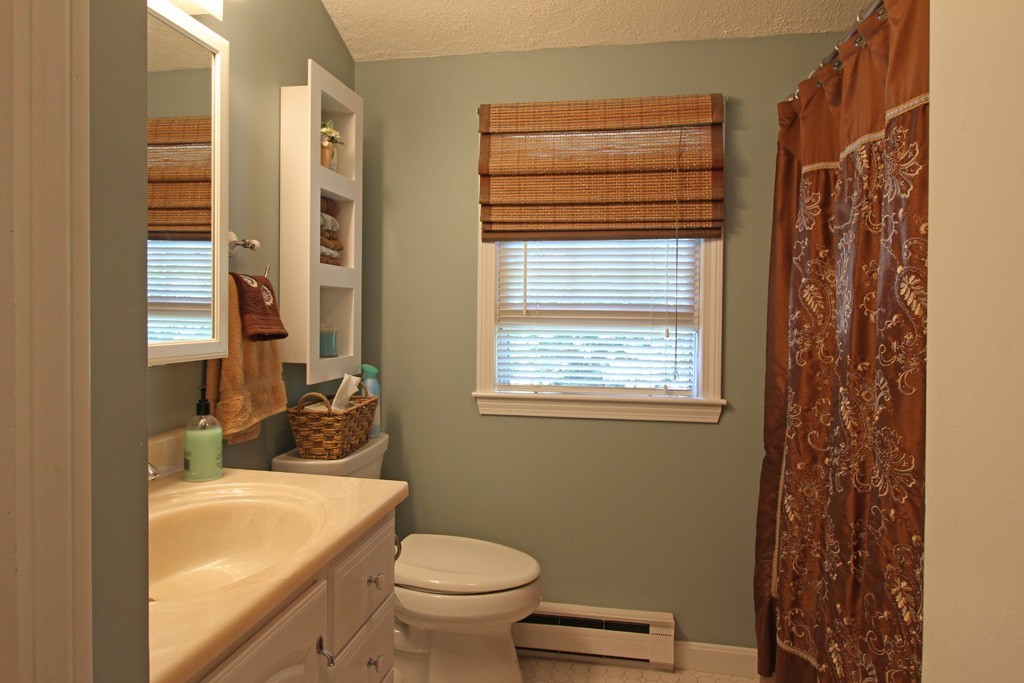 11 Bayberry Hill Road Townsend, MA 01469 - Photo 7 of 21 a bathroom with a sink toilet and shower