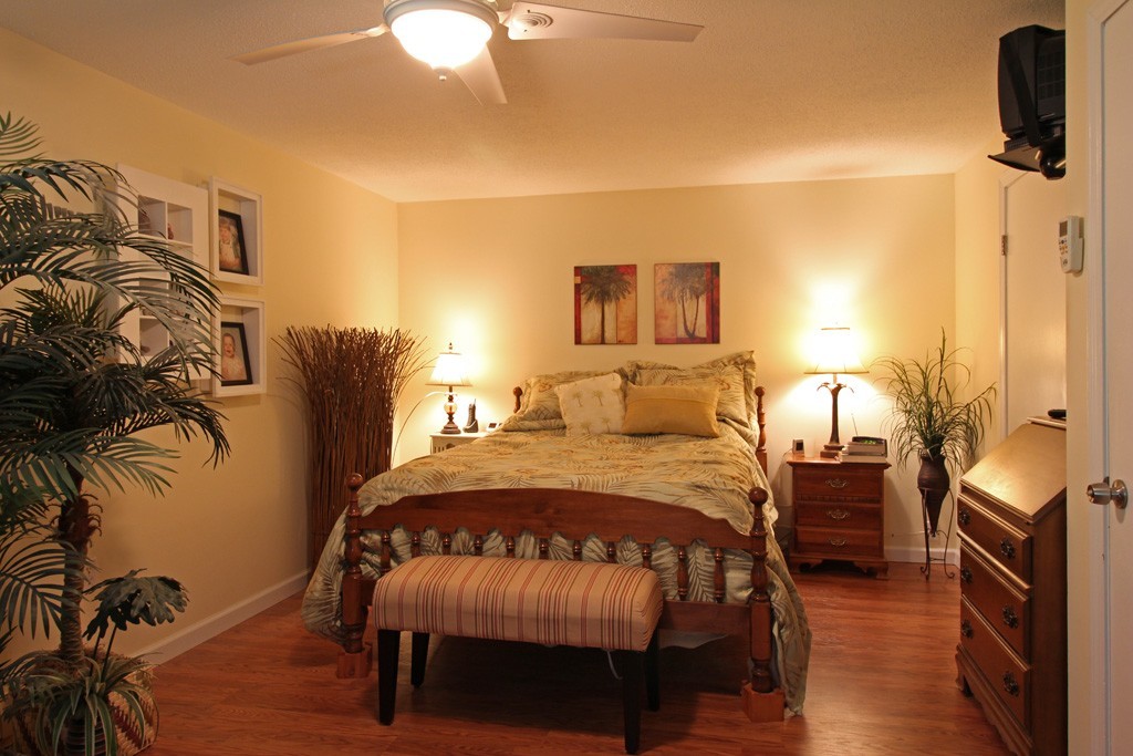 11 Bayberry Hill Road Townsend, MA 01469 - Photo 8 of 21 a bedroom with a bed and potted plants with the wooden floor