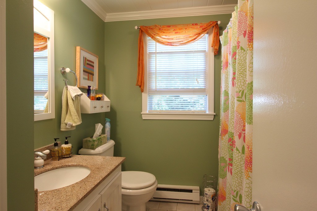 11 Bayberry Hill Road Townsend, MA 01469 - Photo 10 of 21 a bathroom with a granite countertop toilet a sink and a mirror