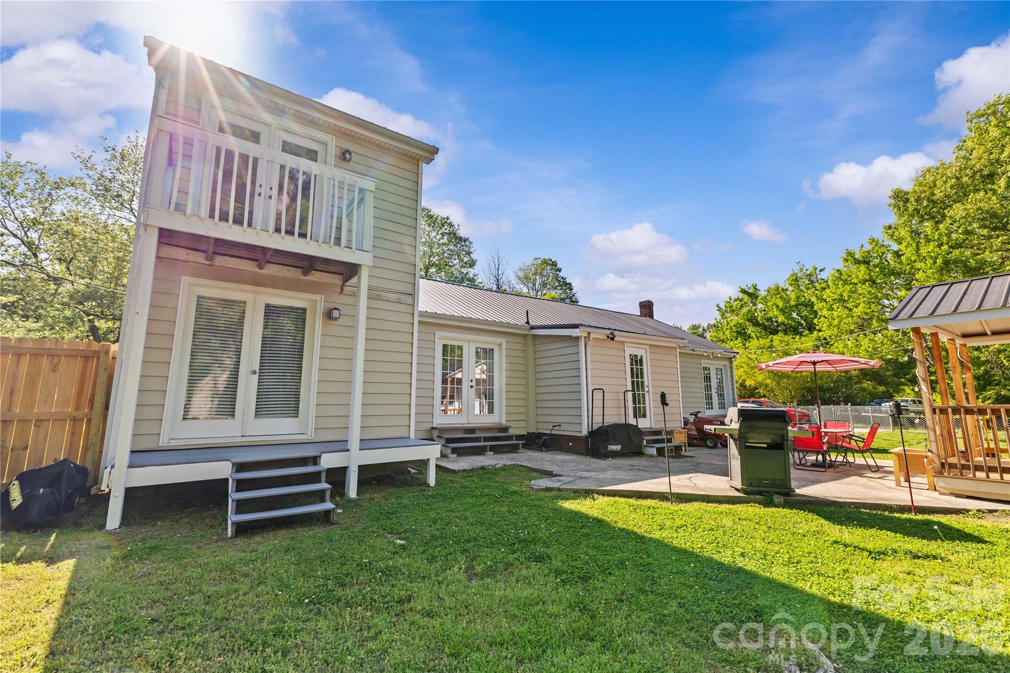 2341 Dixon Road Belmont, NC 28012 - Photo 11 of 42 a backyard of a house with table and chairs