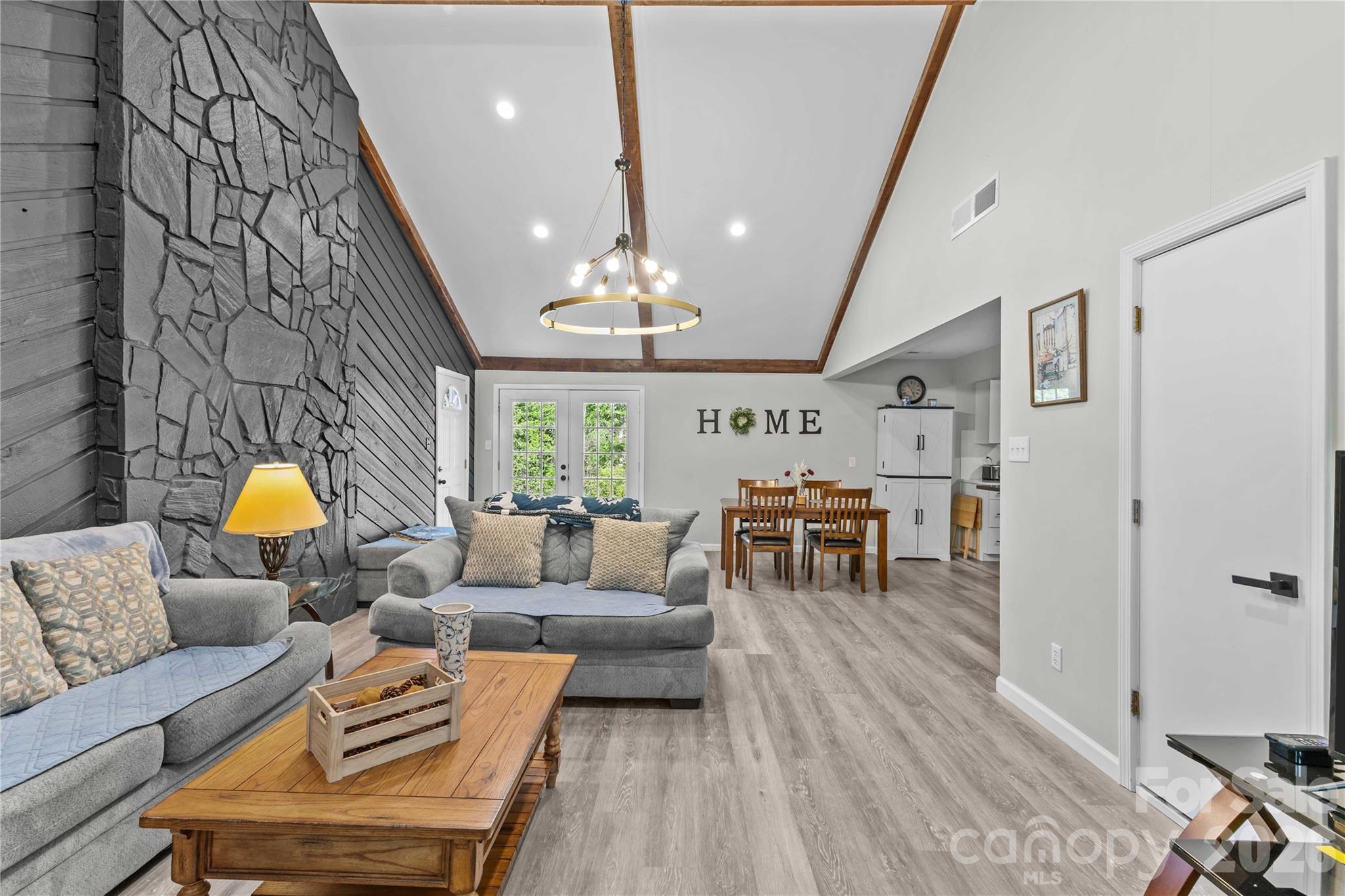 2341 Dixon Road Belmont, NC 28012 - Photo 14 of 42 a living room with furniture and a chandelier