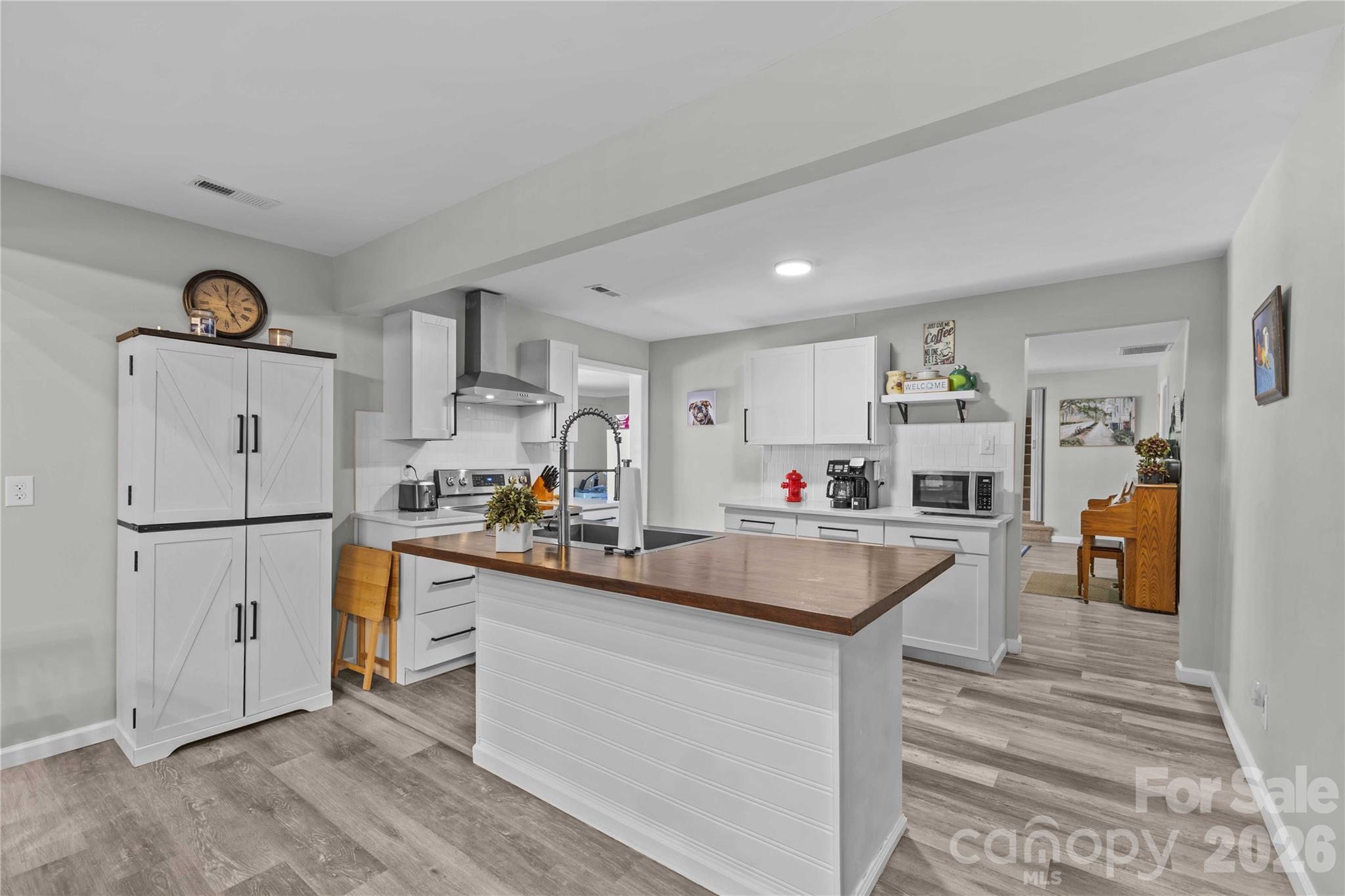2341 Dixon Road Belmont, NC 28012 - Photo 20 of 42 a kitchen with sink a refrigerator and couches
