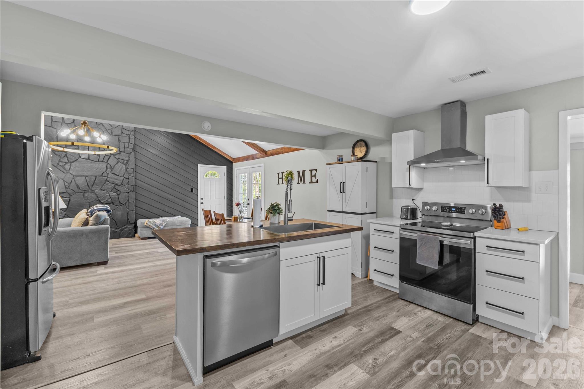 2341 Dixon Road Belmont, NC 28012 - Photo 23 of 42 a kitchen with stainless steel appliances granite countertop a stove and a sink